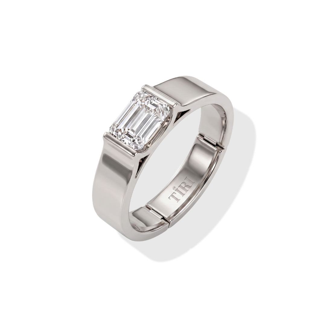 Tiri block style men's band ring made of silver with a bold geometric design, displayed on a neutral background.