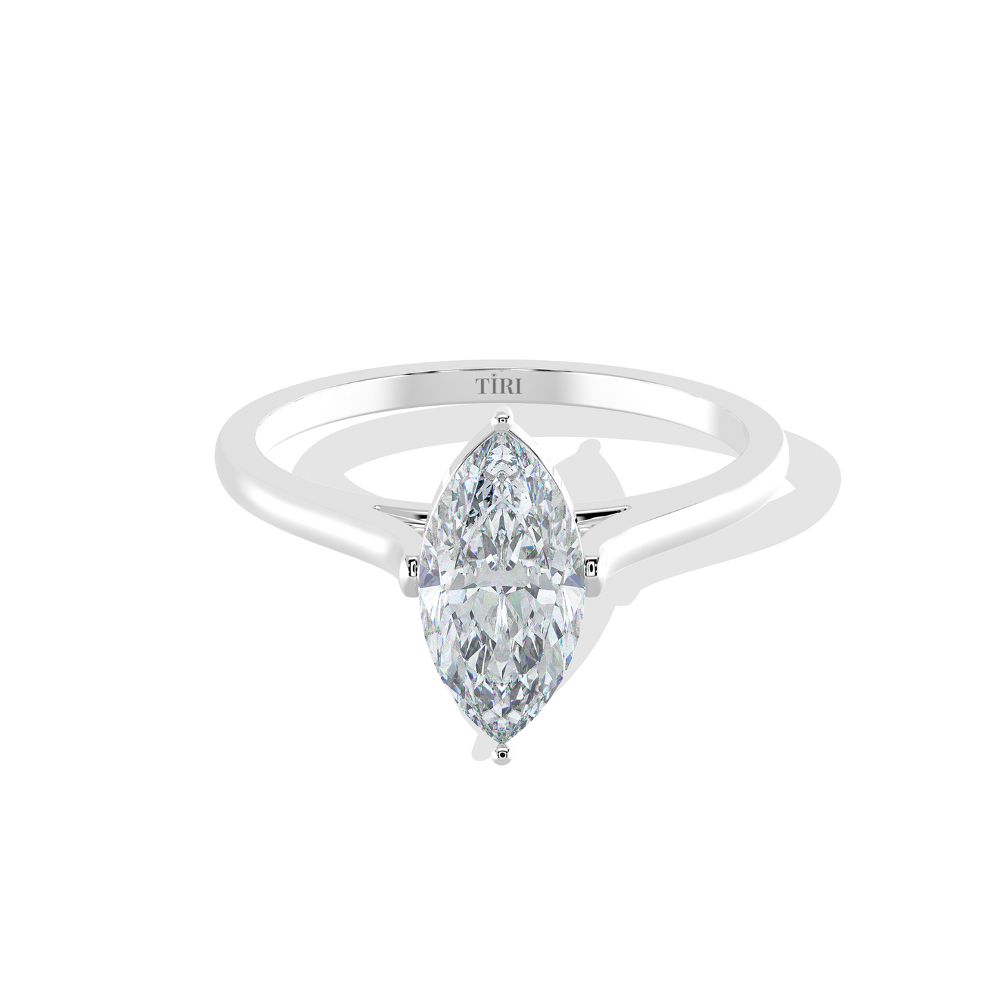 Diamond ring with pear-shaped gemstone on a white background