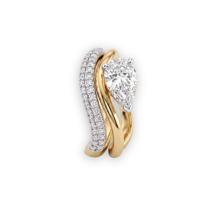 Solis Pear Diamond Ring by Tiri featuring a pear-shaped diamond set in elegant gold, close-up view of the ring's detailed design.