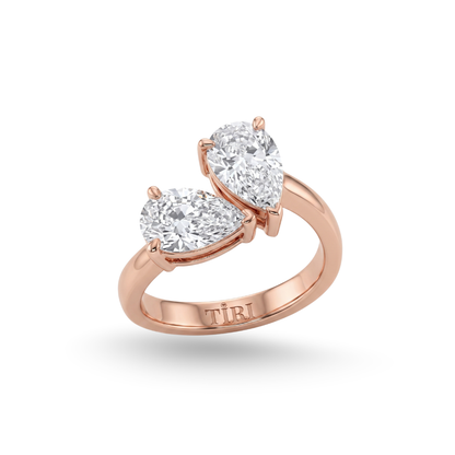 Tiri You-and-Me Pear Cut Diamond Ring featuring a pear-shaped diamond set in a delicate gold band.