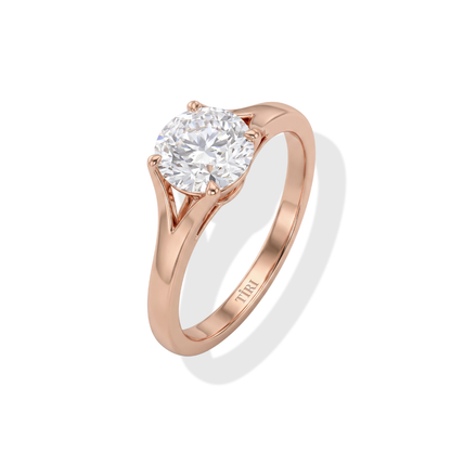 Round solitaire diamond ring by Tiri featuring a sparkling central diamond set in a sleek band.
