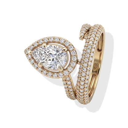 Tiri Empress Pear Diamond Ring featuring a large pear-shaped diamond set in a sleek gold band.