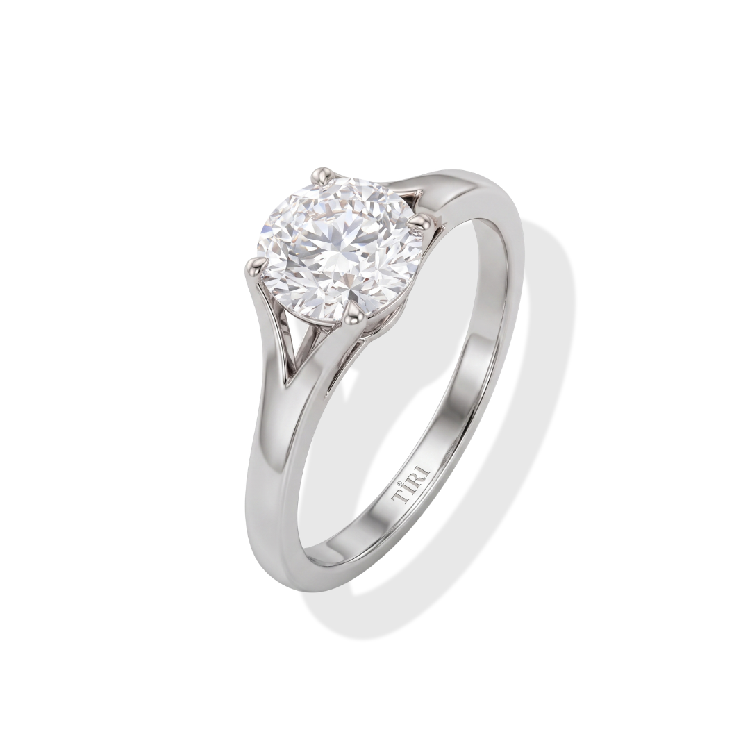 Tiri round solitaire diamond ring featuring a single sparkling diamond set in a sleek band.