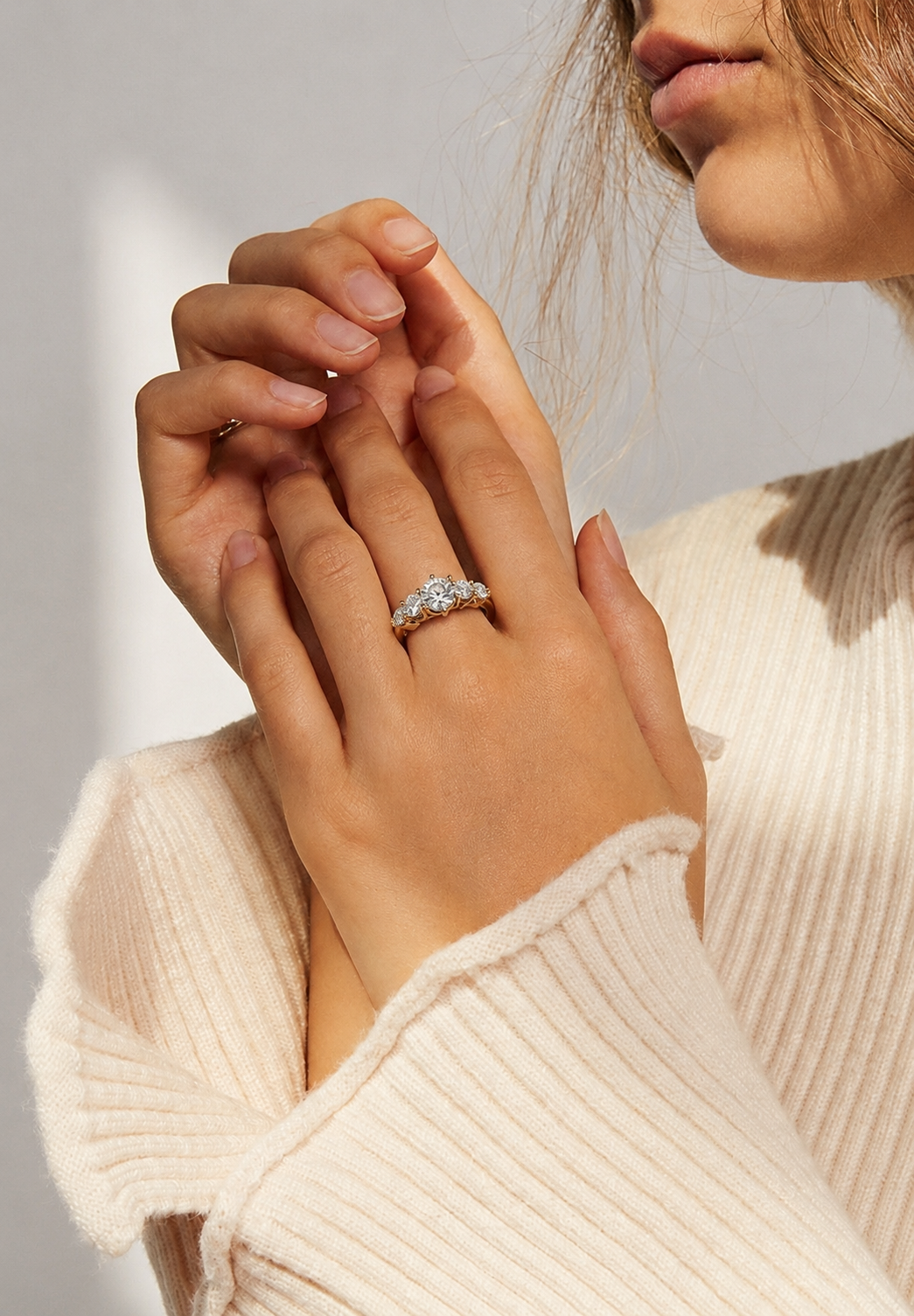 Tiri Valoria diamond ring featuring a sparkling central diamond set in a sleek, elegant band on a white background.