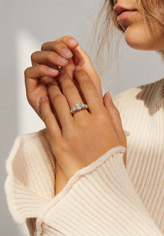 Tiri Valoria diamond ring featuring a sparkling central diamond set in a sleek, elegant band on a white background.