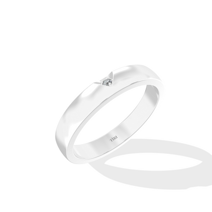 Tiri 0.10 TW diamond ring featuring a sleek band with sparkling diamonds on a white background.