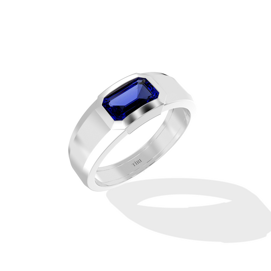 Tiri 4.00 TW sapphire ring with a silver band showcasing a large central blue sapphire gemstone.
