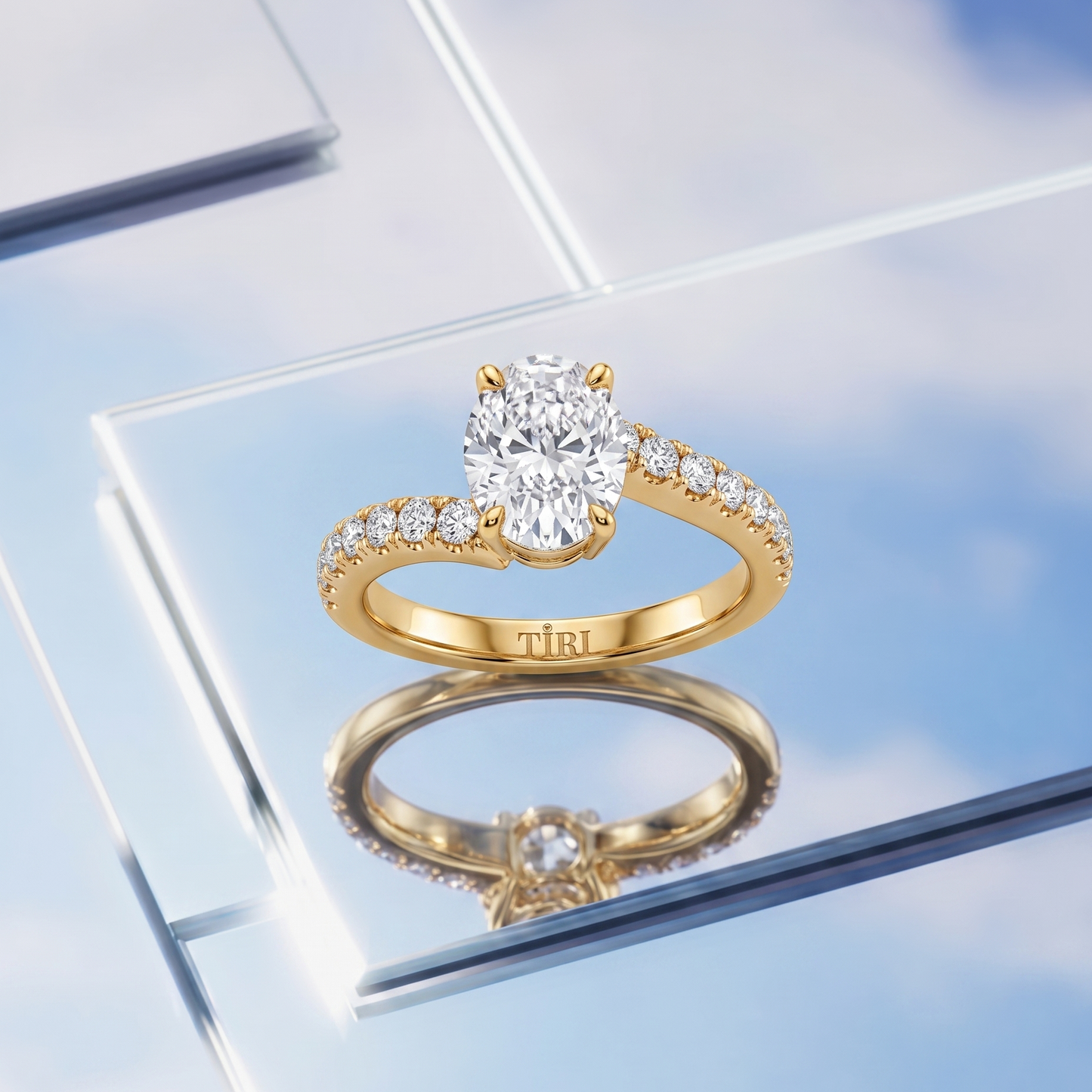 Tiri oval engagement diamond ring with a sparkling central diamond set in a sleek band, showcasing elegant craftsmanship.