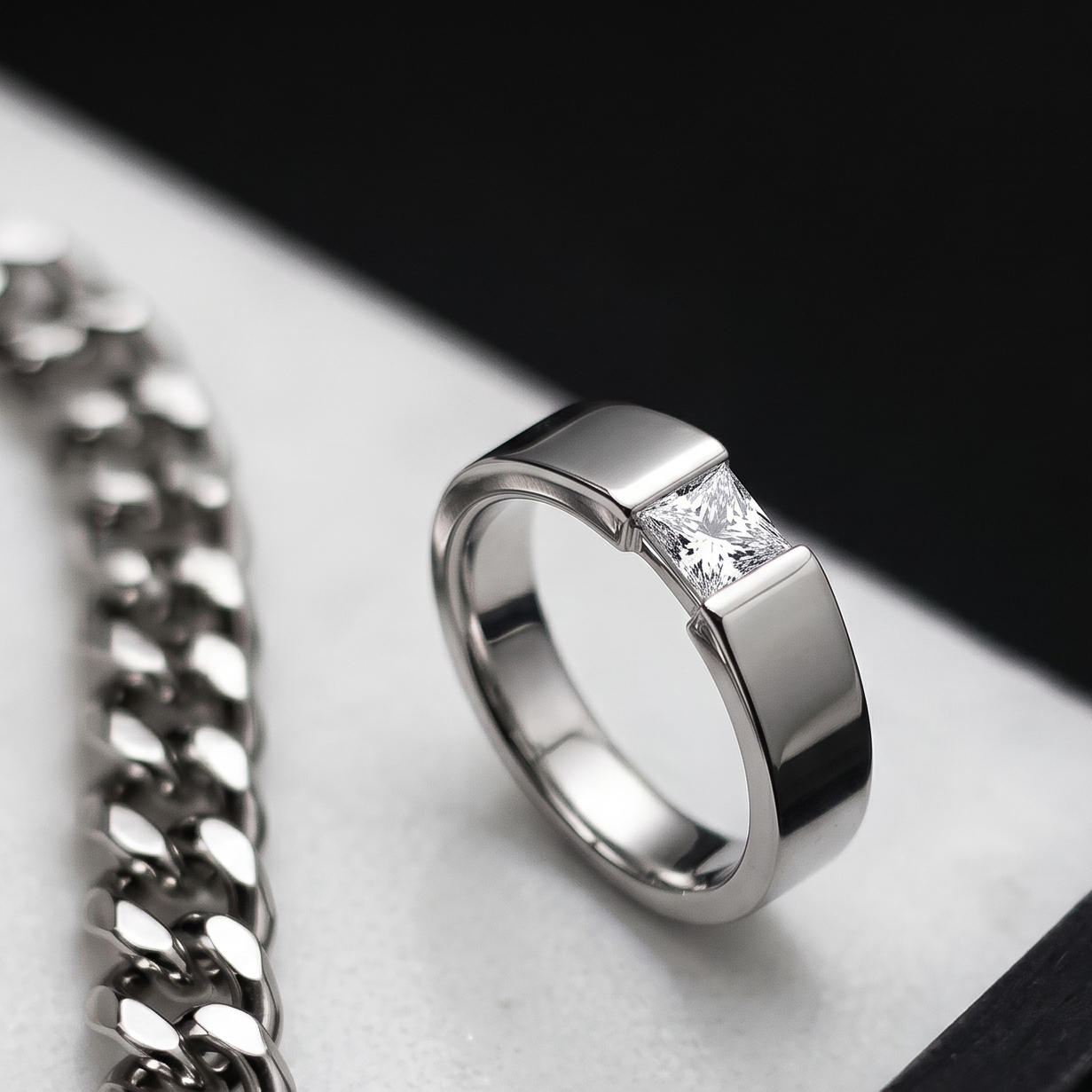Tiri Quadrant Solitaire men's diamond ring featuring a sleek band and a central diamond setting.