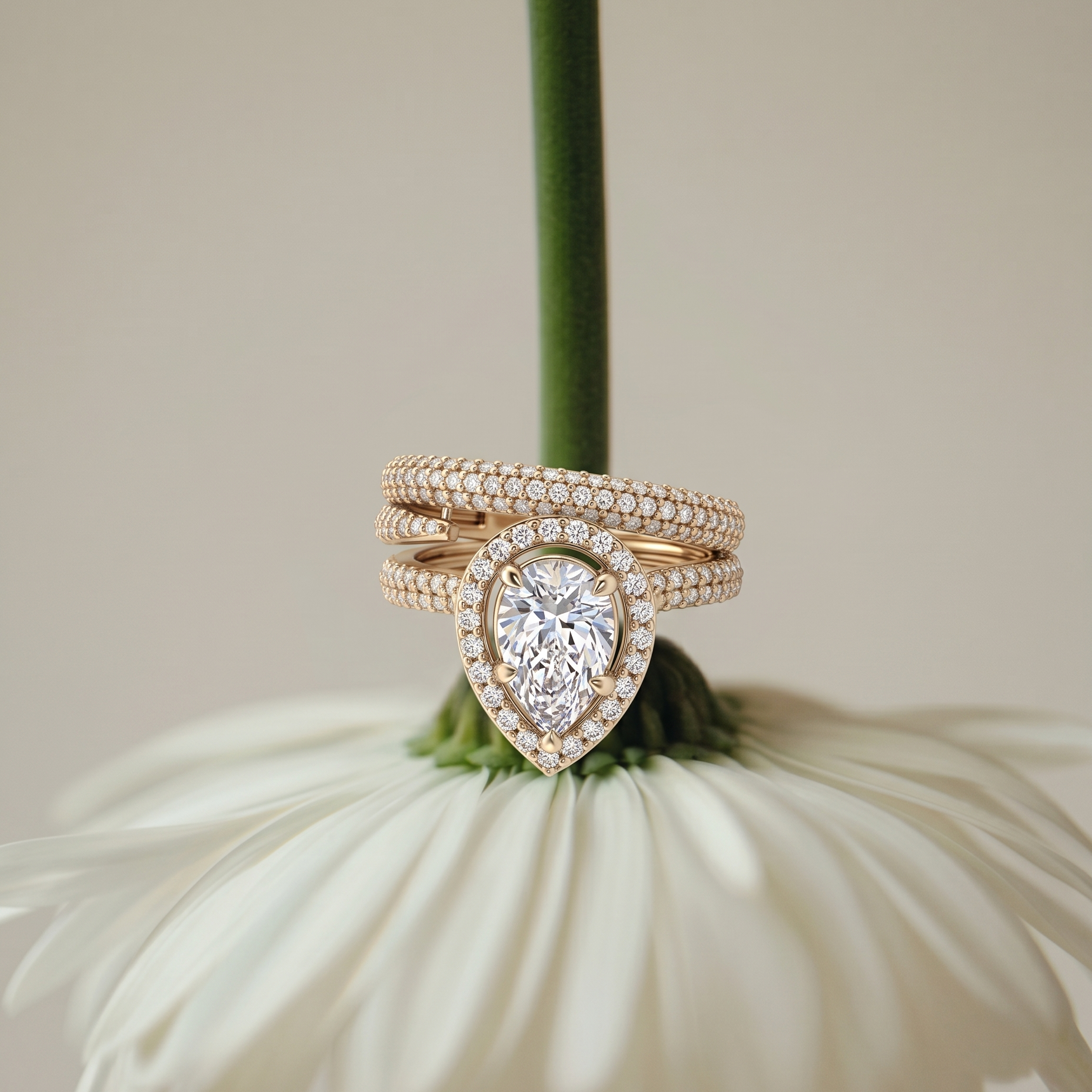 Tiri Empress Pear Diamond Ring featuring a large pear-shaped diamond set in a delicate band on a white background.