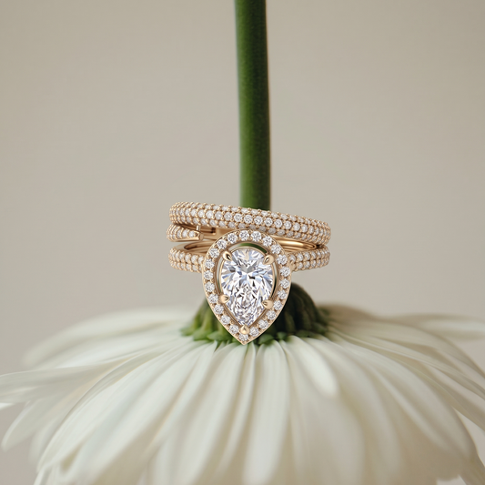 Tiri Empress Pear Diamond Ring featuring a large pear-shaped diamond set in a delicate band on a white background.