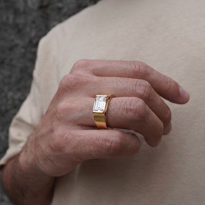 Tiri block style men's band ring with geometric design, made of polished metal, displayed on a neutral background.