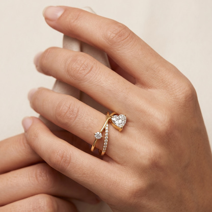 Tiri crossover heart diamond ring featuring a delicate band with sparkling diamonds and a romantic heart-shaped design.