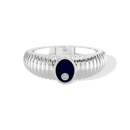 Tiri 0.10 TW diamond ring featuring a sleek band and sparkling diamonds on a white background.