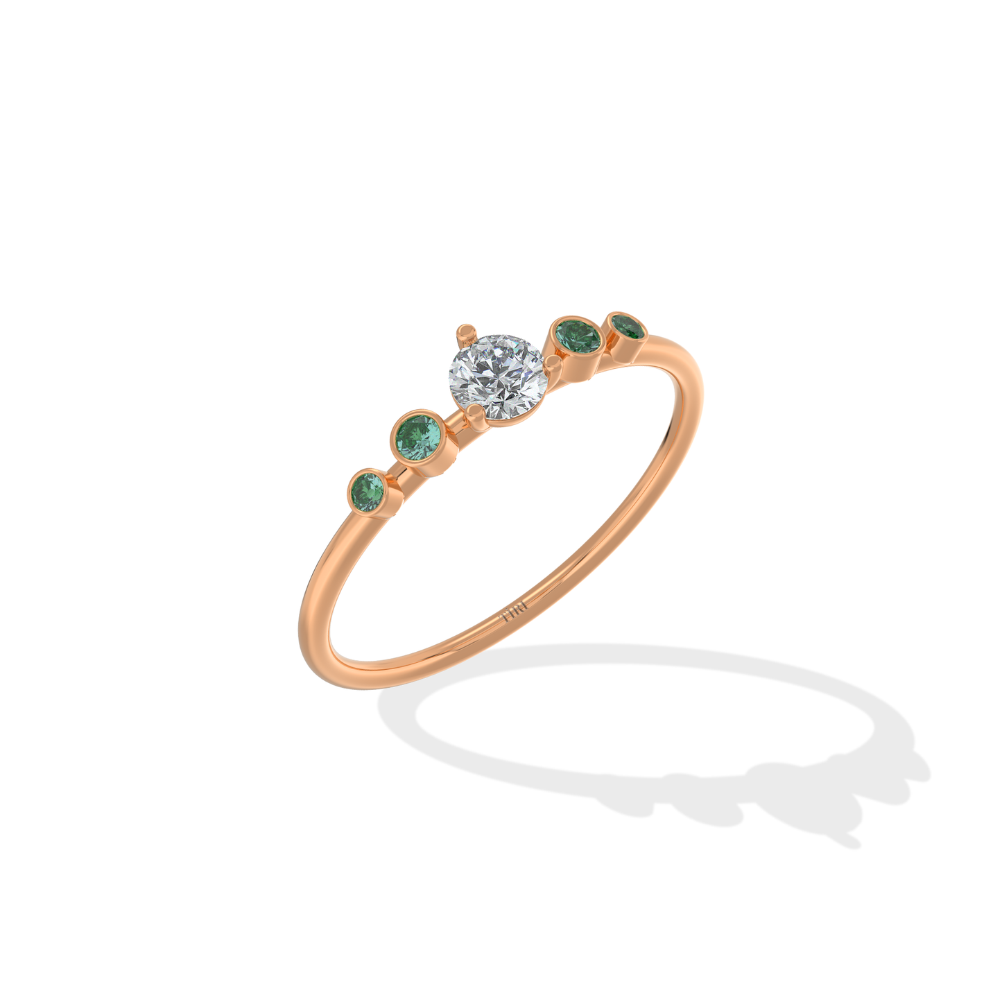 Tiri Avira Emerald Ring featuring a vibrant emerald gemstone set in a silver band with intricate detailing.