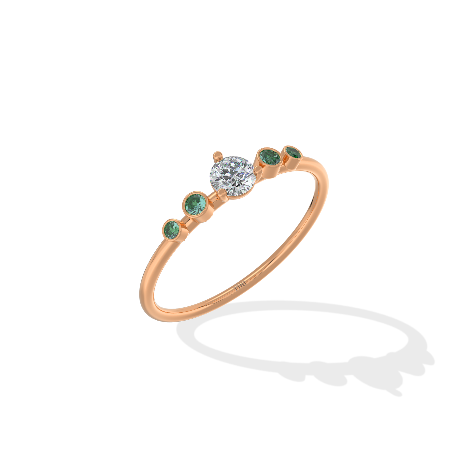 Tiri Avira Emerald Ring featuring a vibrant emerald gemstone set in a silver band with intricate detailing.