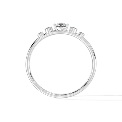 Tiri Avira Emerald Ring featuring a vibrant green emerald gemstone set in a silver band with intricate detailing.