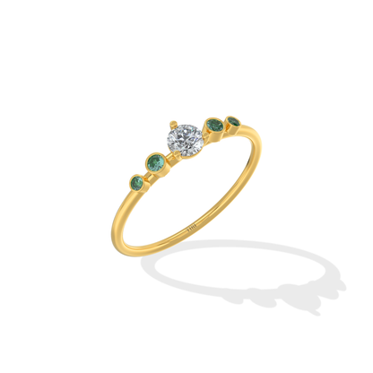 Tiri Avira Emerald Ring featuring a large green emerald gemstone set in a silver band with intricate detailing.