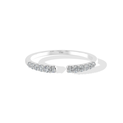 Elegant 0.20 TW diamond ring by Tiri featuring a sparkling diamond band with intricate design and polished finish.