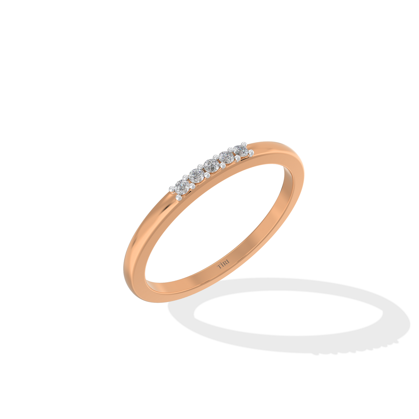 Rose gold three-stone diamond ring featuring three round brilliant-cut stones. Classic trilogy engagement ring.
