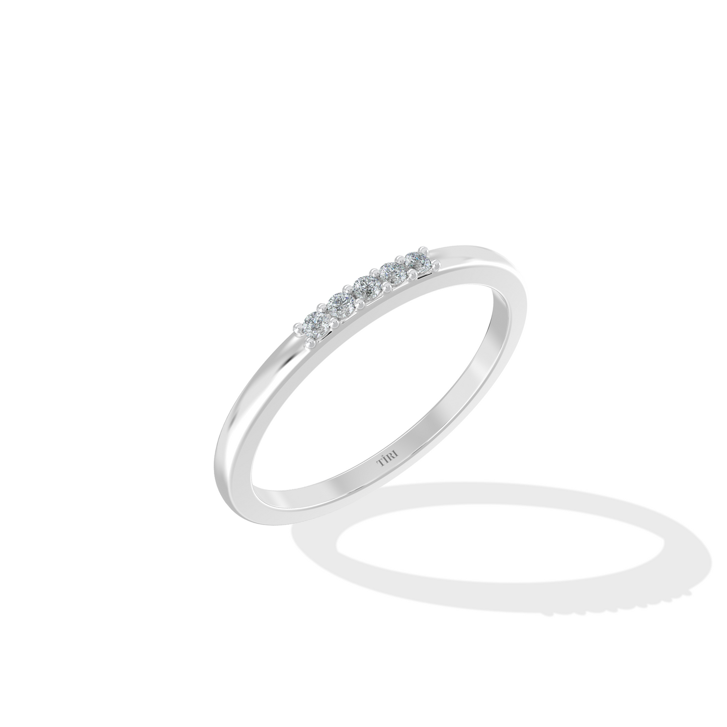 White gold three-stone diamond ring featuring three round brilliant-cut stones. Classic trilogy engagement ring.