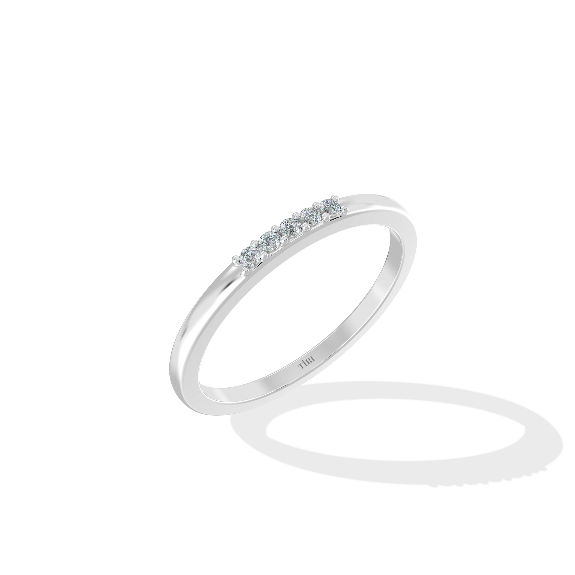 White gold three-stone diamond ring featuring three round brilliant-cut stones. Classic trilogy engagement ring.