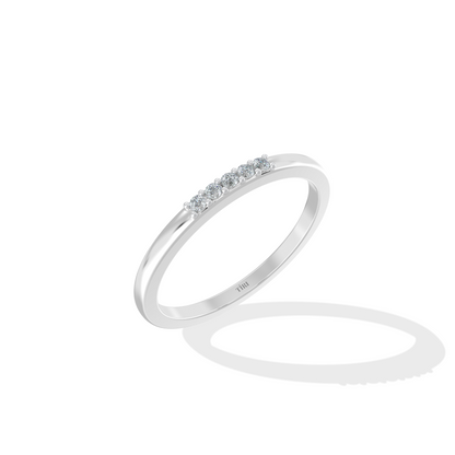 White gold three-stone diamond ring featuring three round brilliant-cut stones. Classic trilogy engagement ring.