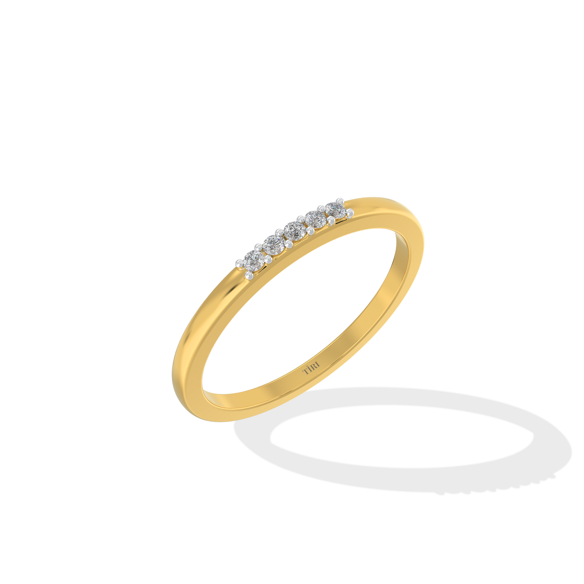 Yellow gold three-stone diamond ring featuring three round brilliant-cut stones. Classic trilogy engagement ring.