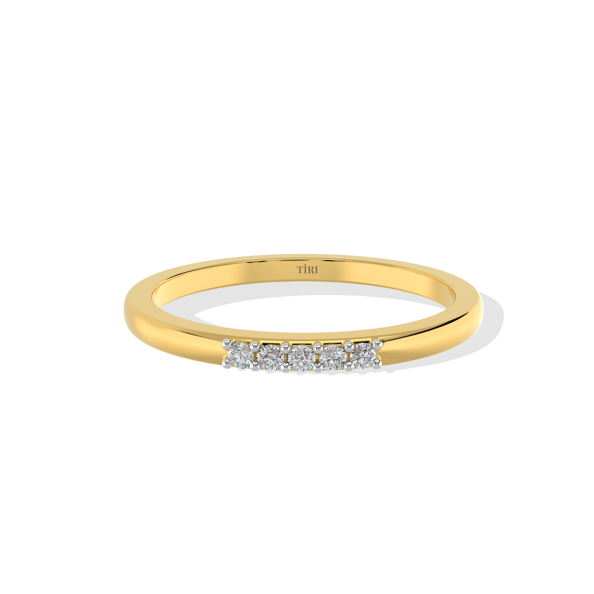 Yellow gold three-stone diamond ring featuring three round brilliant-cut stones. Classic trilogy engagement ring.