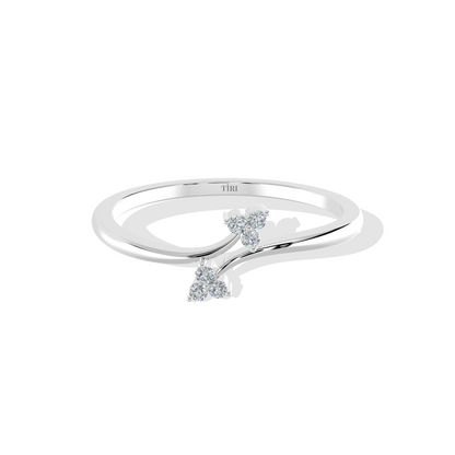 White gold oval diamond engagement ring set horizontally (East-West setting) with a halo of accent stones and a pave band