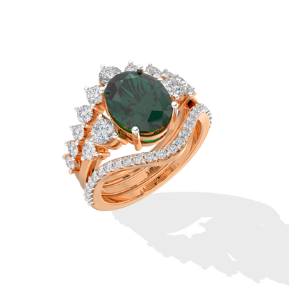 Luxury gold ring featuring an oval deep green gemstone with a halo of round diamonds and a split diamond band, photographed on a white background