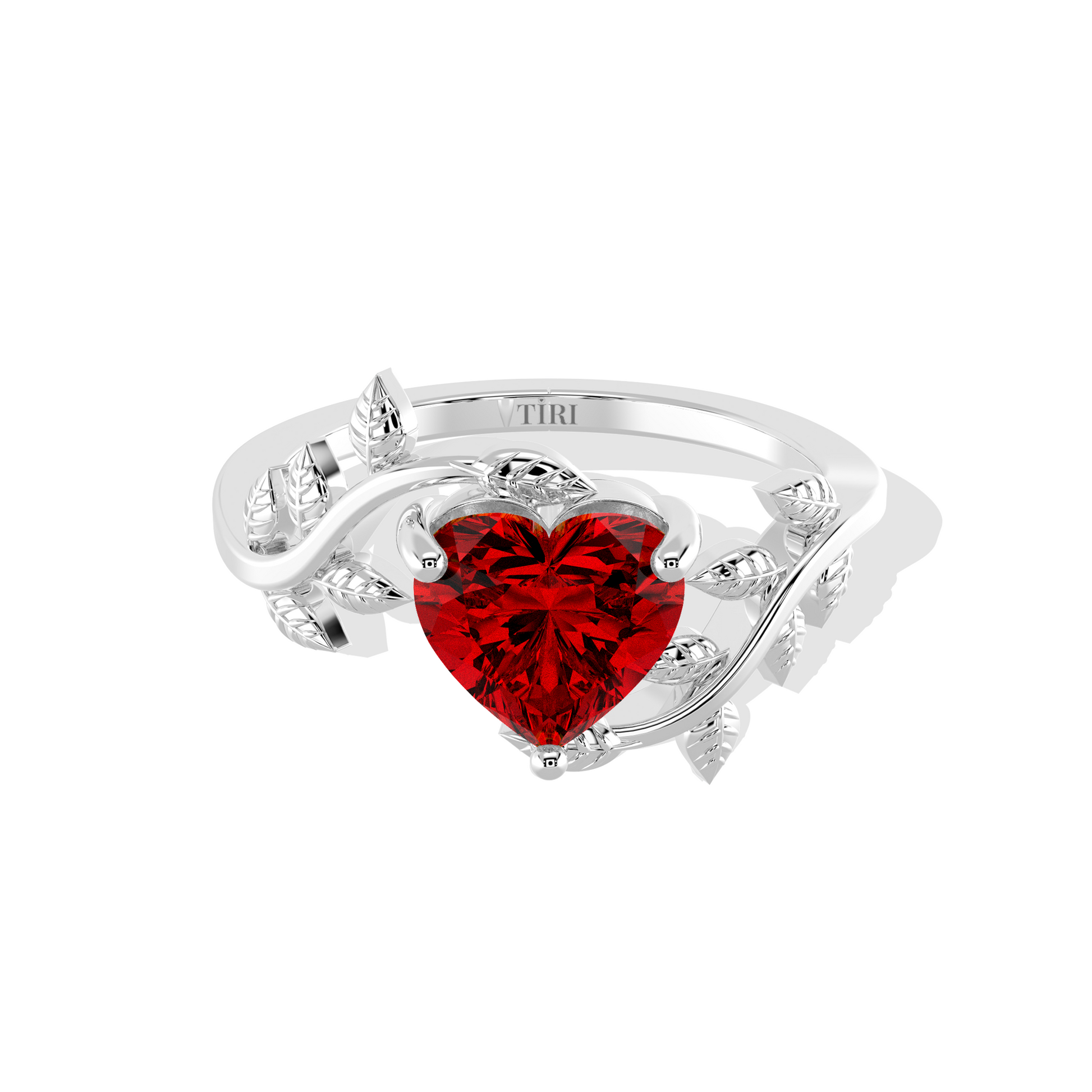 Heart-shaped red gemstone ring with diamond leaf accents.