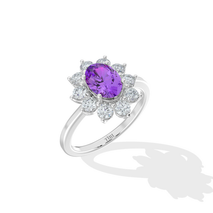 Silver ring with a purple gemstone on a white background