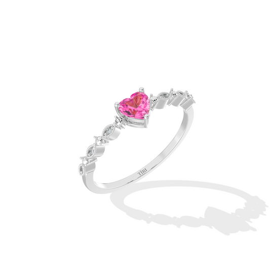 Silver ring with a pink heart-shaped gemstone on a white background