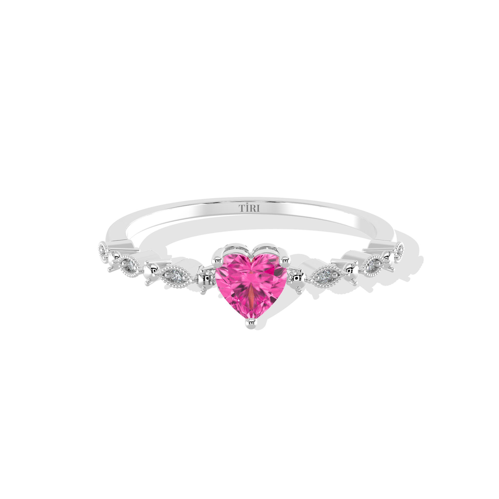 Silver ring with a pink heart-shaped gemstone on a white background