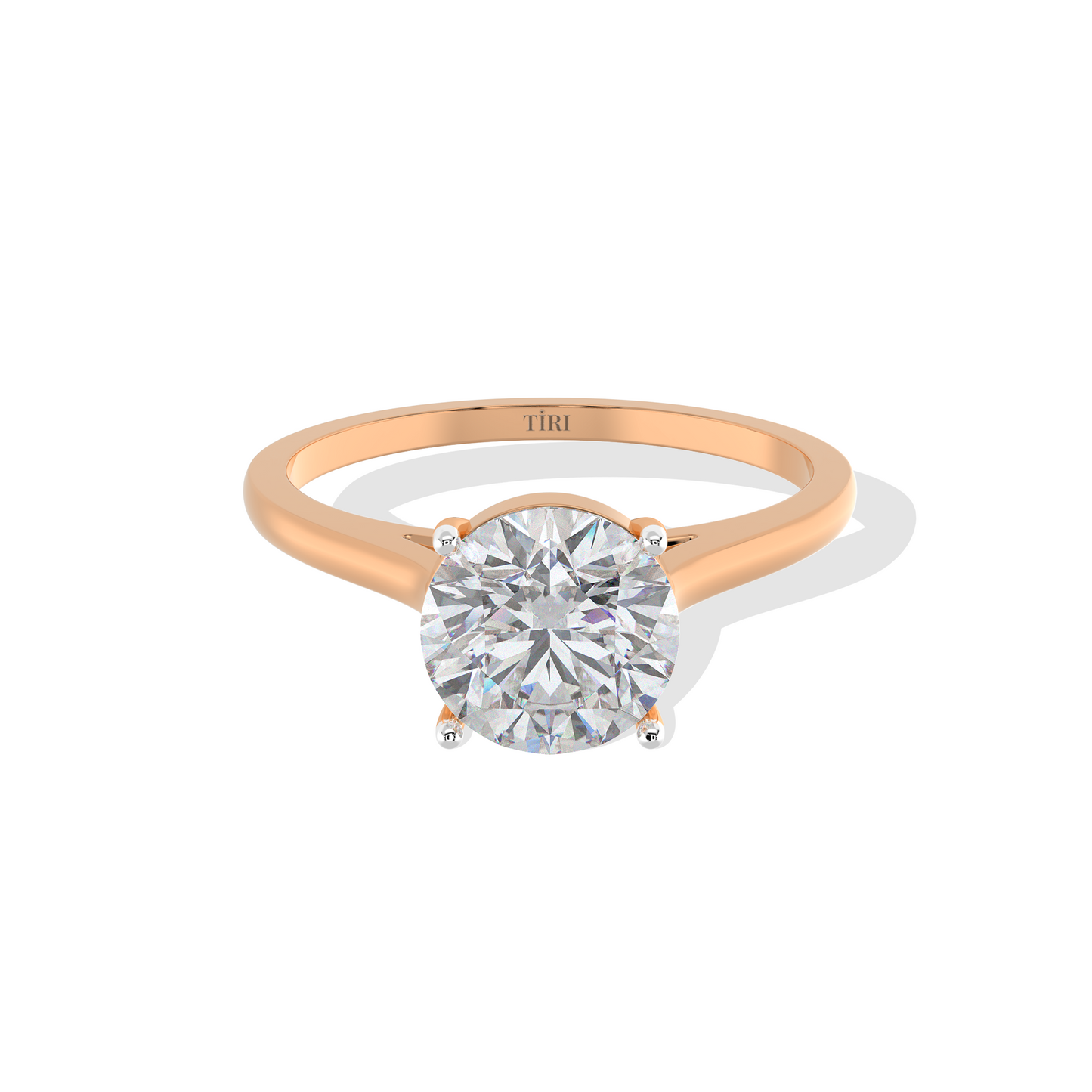 Round-cut solitaire diamond ring set in rose gold.