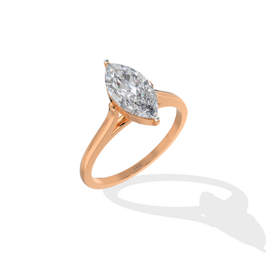 Marquise diamond ring in rose gold setting with delicate band, ideal for engagement or wedding