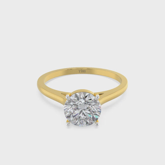 Round-cut solitaire diamond ring set in yellow gold