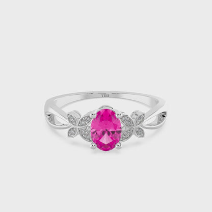 White gold ring with a pink gemstone on a white background