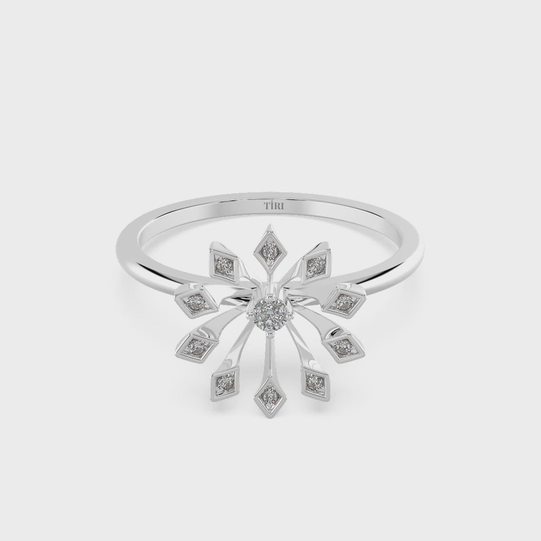 White gold round solitaire diamond engagement ring with a delicate thin band. Classic fine jewelry