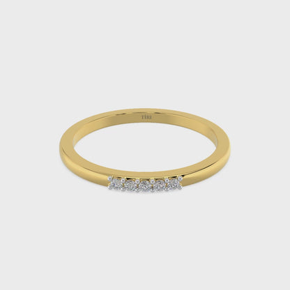 Yellow gold three-stone diamond ring featuring three round brilliant-cut stones. Classic trilogy engagement ring.