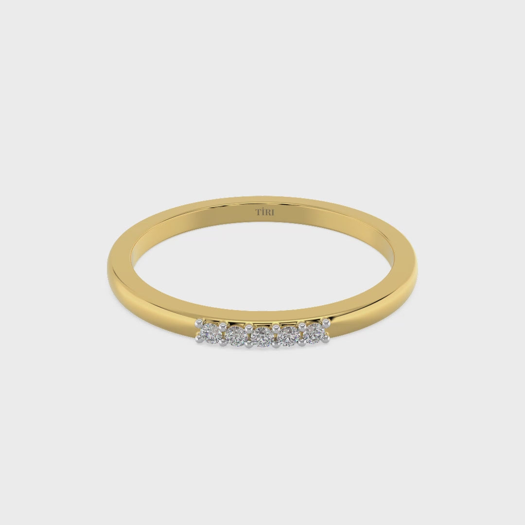 Yellow gold three-stone diamond ring featuring three round brilliant-cut stones. Classic trilogy engagement ring.